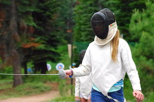 A camper preparing to fence