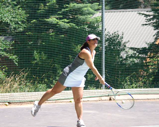 A guest hitting a tennis ball