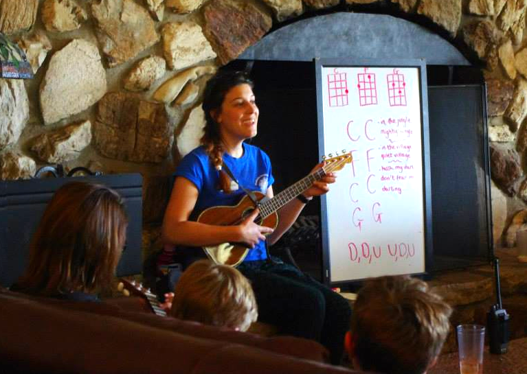 A counselor teaching Ukulele